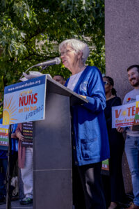 Sr. Alice Gerdeman, SC is the emcee at the Pittsburgh, PA Nuns on the Bus & Friends rally