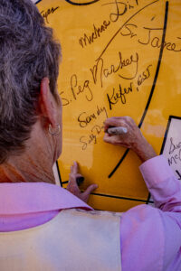 Sr. Sally Duffy signs the bus