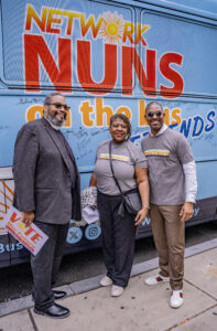 Bishop Dwayne Royster (l) with Bus Riders Rev. Dr. Cassandra Gould, Rev. Dr. Starsky Wilson, pictured by the side of the bus after the Philadelphia kick off rally. Reverends Royster and Gould each issued powerful call to vote