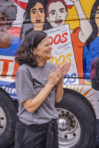 NETWORK's Laura Peralta-Schulte applauds the call to vote at the Nuns on the Bus rally in Love Park, Philadelphia, PA